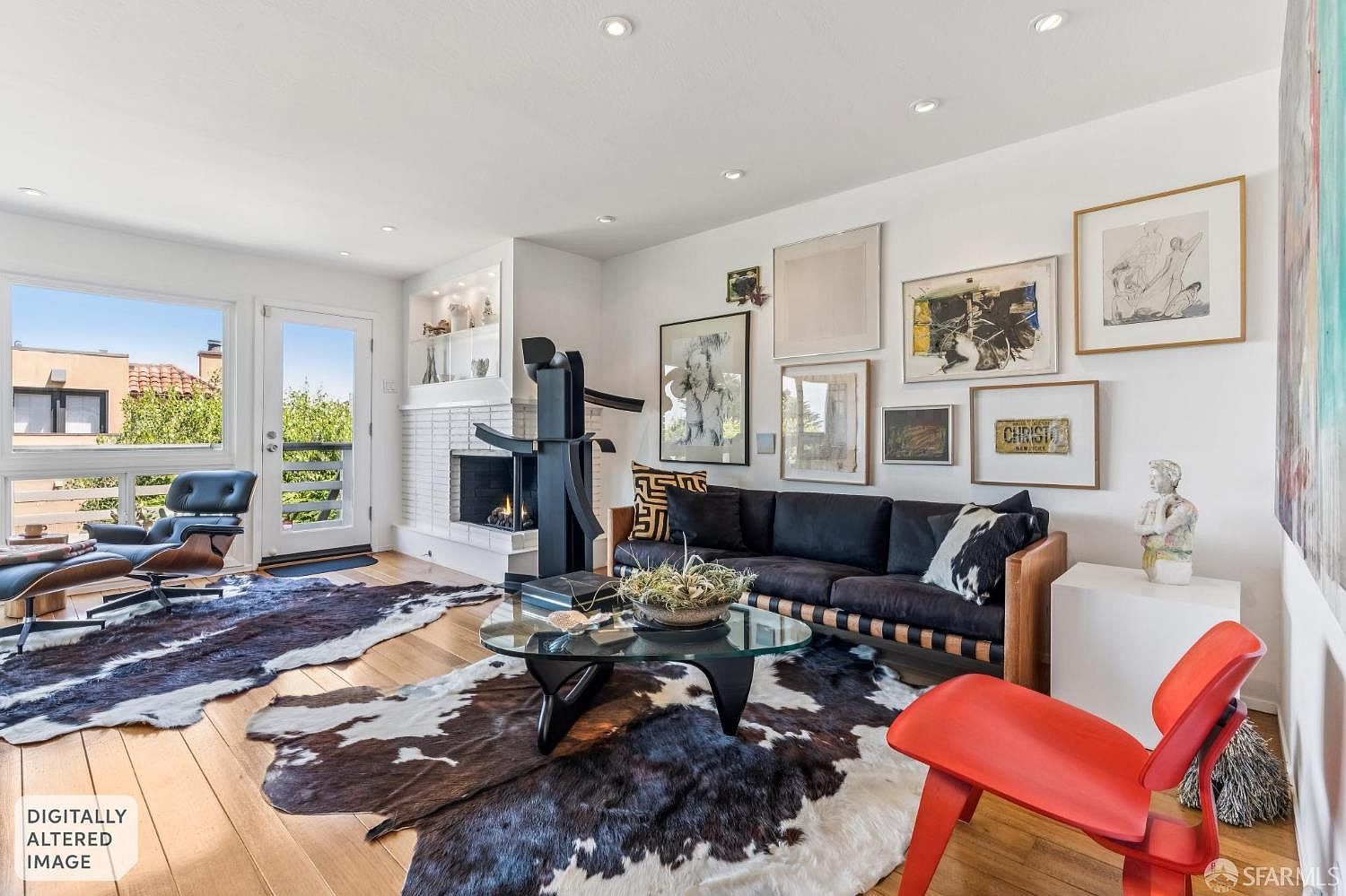 Mid-century living room at 138 Clifford Terrace with a white-brick corner fireplace, original mahogany floors, leather seating, and glass doors opening to a balcony with city views